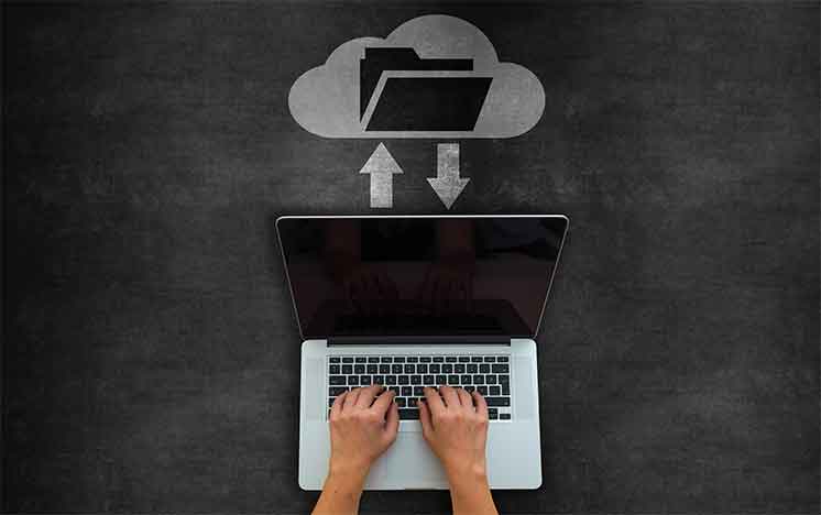 Worker accessing digital documents through cloud storage.